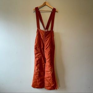 Rust colored flared retro ski bibs